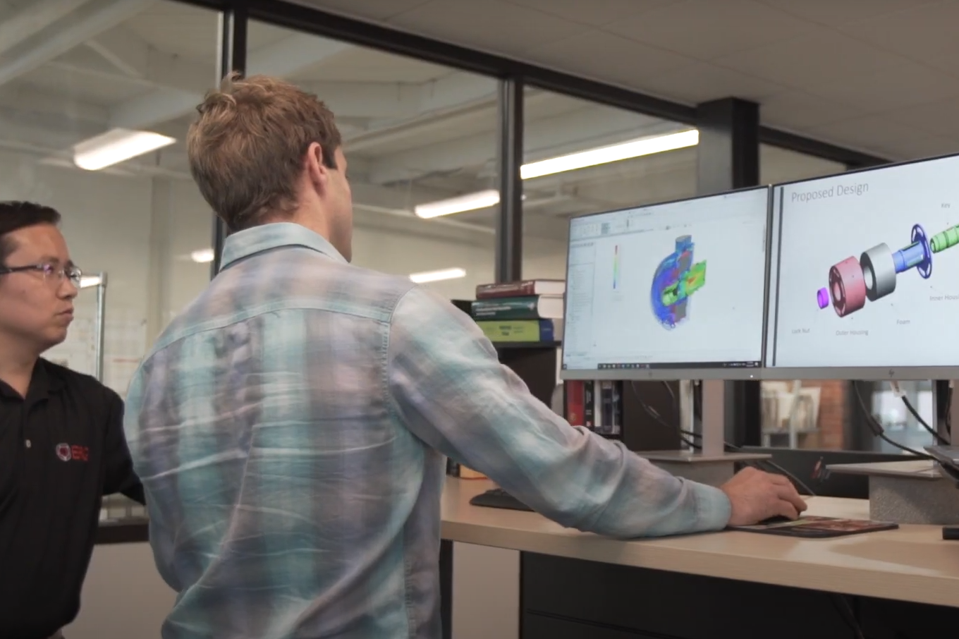 Engineers discuss results of CFD simulation